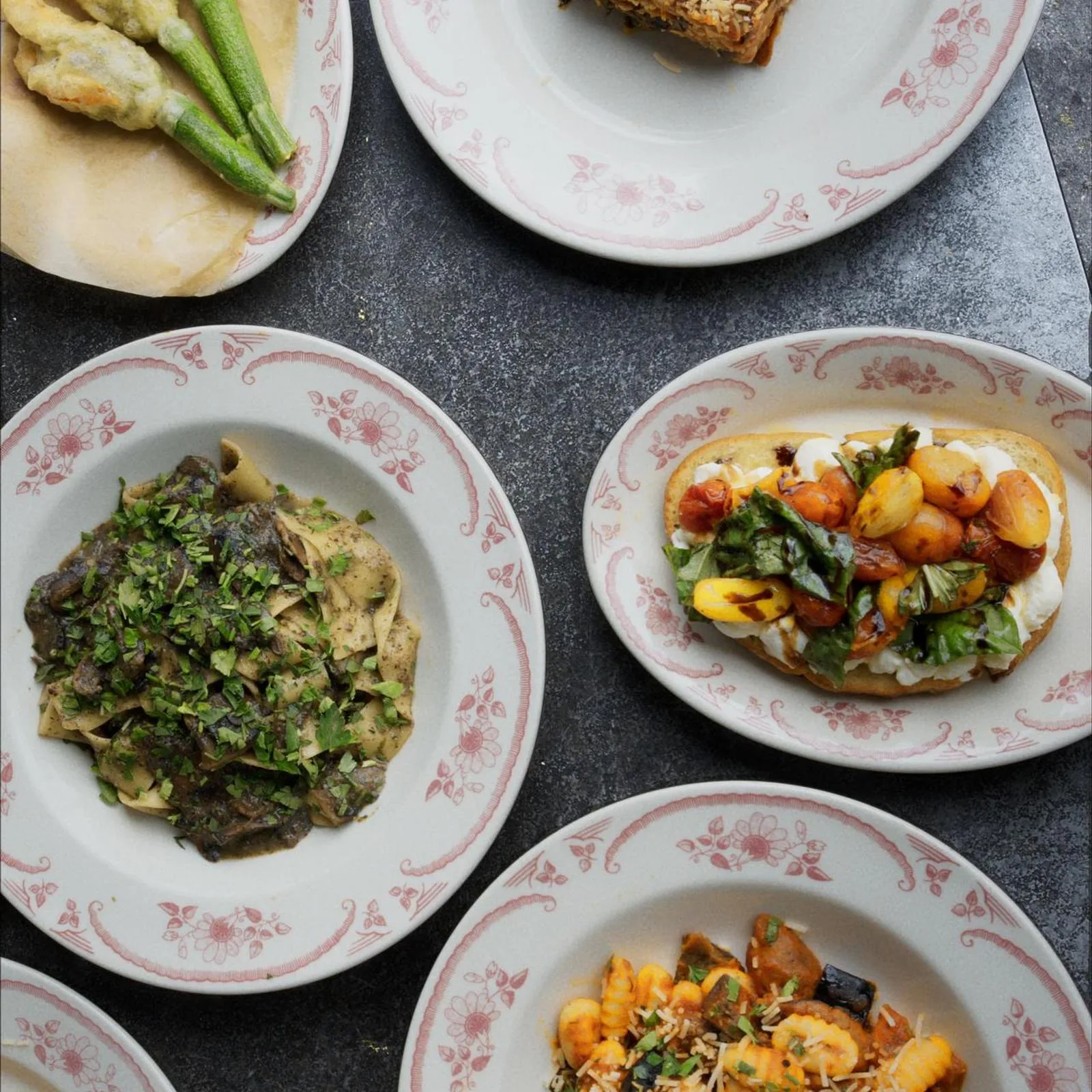 Seasonal Italian dishes arranged on a Civico 1845 table