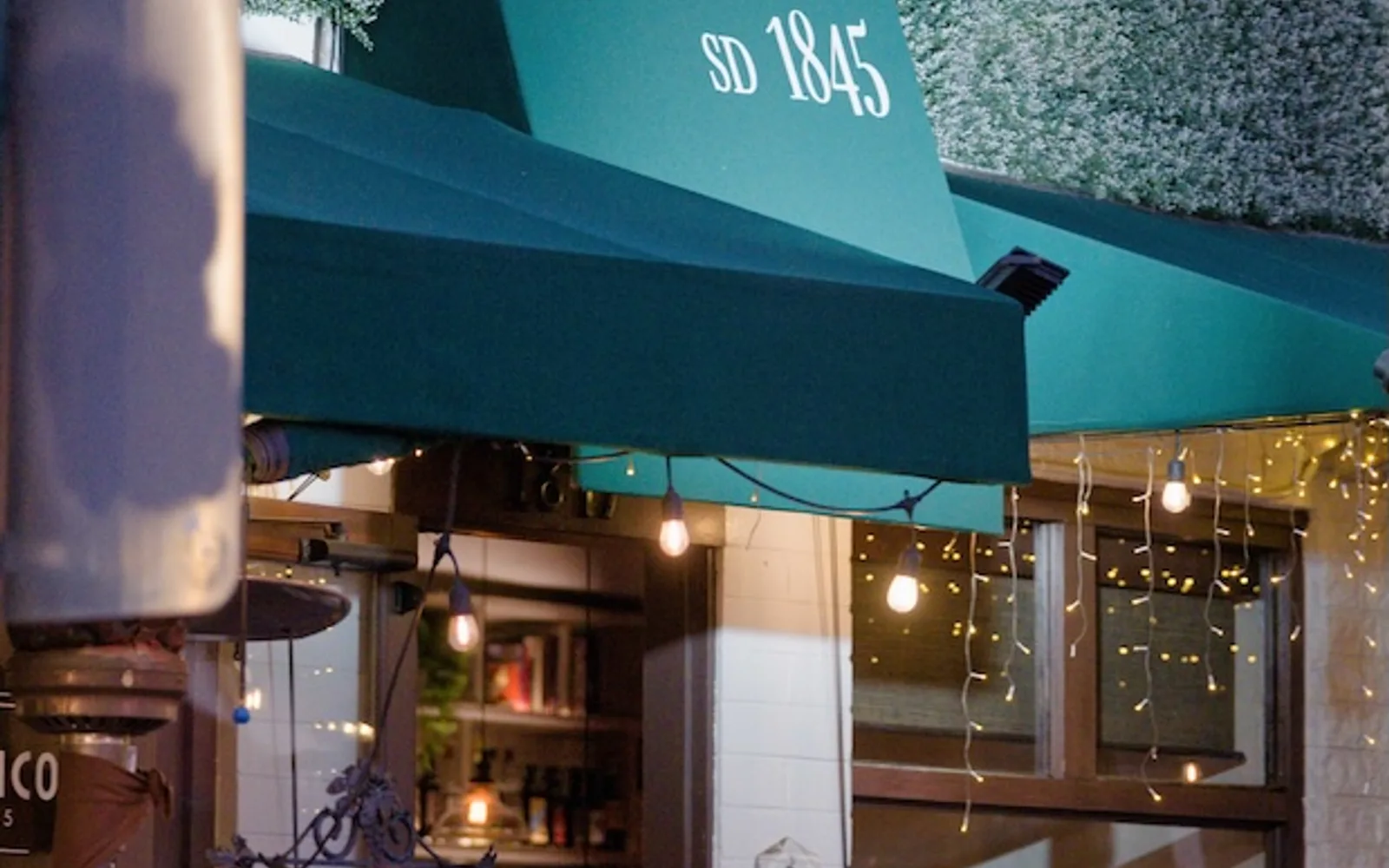 Civico 1845's green-awning storefront in Little Italy, San Diego